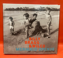 Load image into Gallery viewer, BILLY BRAGG & WILCO - MERMAID AVENUE (THE COMPLETE SESSIONS) - 3X CD + DVD DELUXE SET
