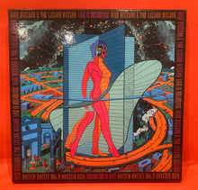 Load image into Gallery viewer, KING GIZZARD & THE LIZARD WIZARD - LIVE IN MELBOURNE - 3X LP BOX SET - COKE BOTTLE GREEN SPLATTER VINYL