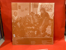Load image into Gallery viewer, CHAINSAW SPROCKET KNUCKLEHEAD TANK - BLACK DENIM TROUSERS AND MOTOR CYCLE BOOTS AND A BLACK LEATHER JACKET WITH AN EAGLE ON THE BACK LP - VINYL
